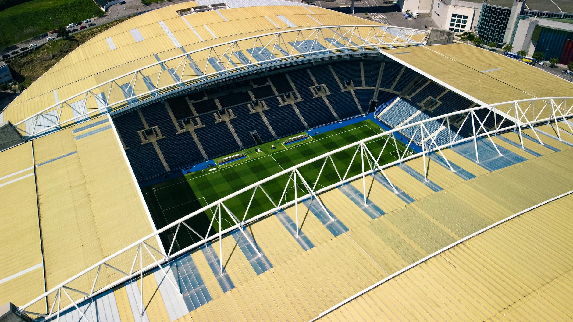 A captivating aerial shot of Estádio do Dragão in Porto, showcasing its iconic structure and football field.